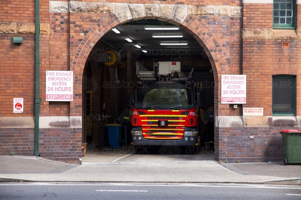 fire truck in fire station, horizontal - Australian Stock Image