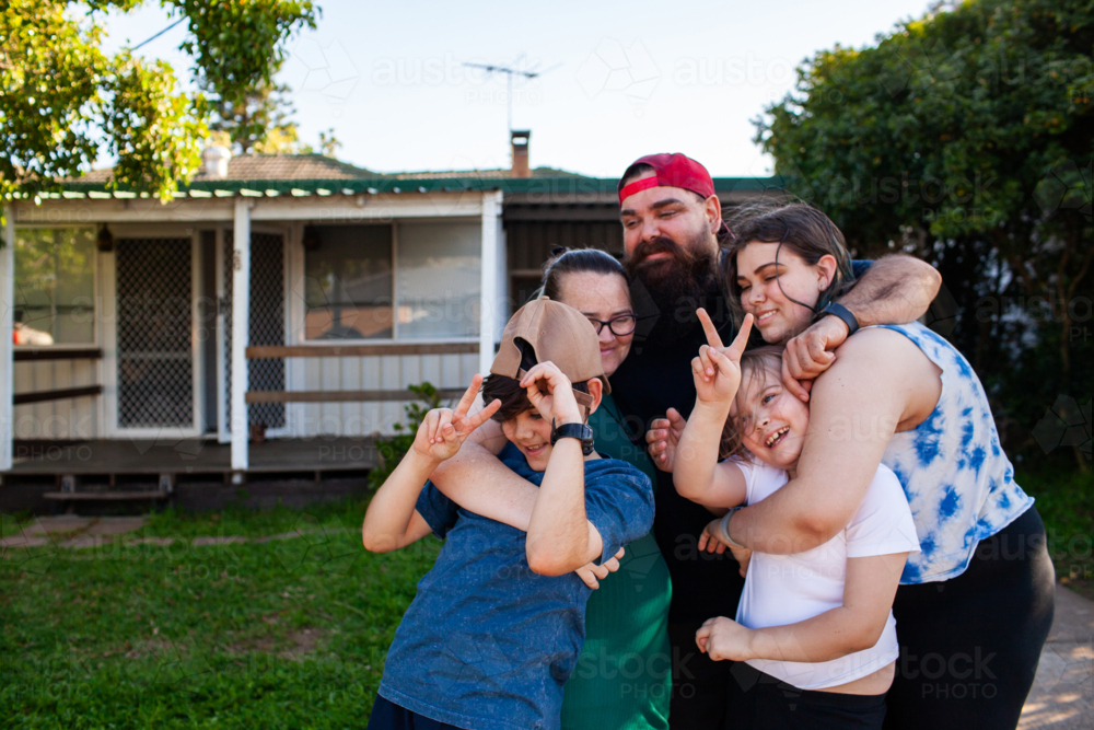 First Nations Australian family being silly together outdoors - Australian Stock Image