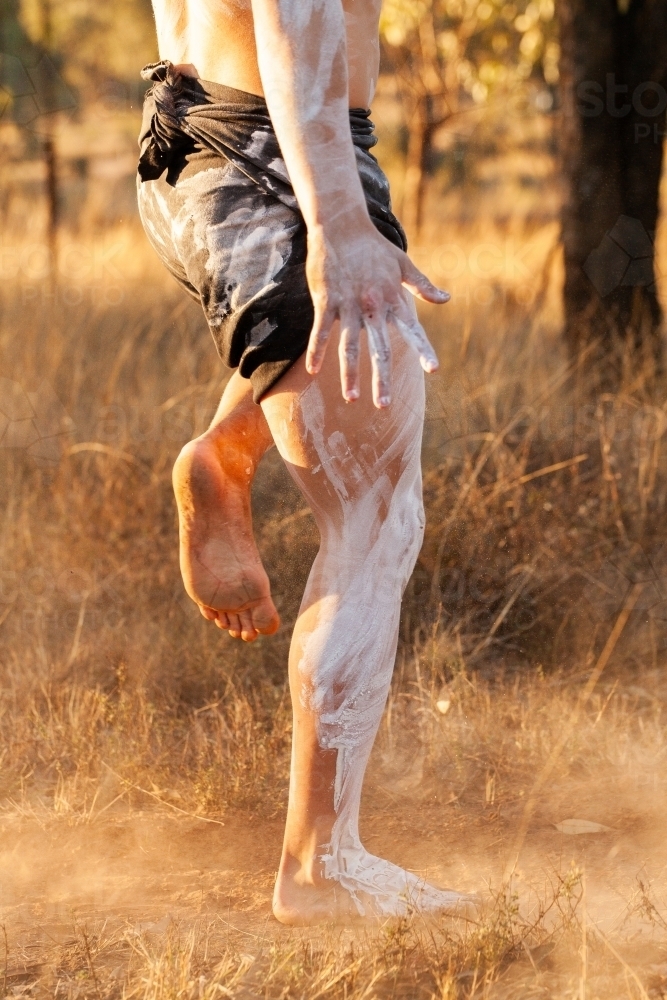 First Nations Australian young dancing singing song for traditional storytelling dance on country - Australian Stock Image