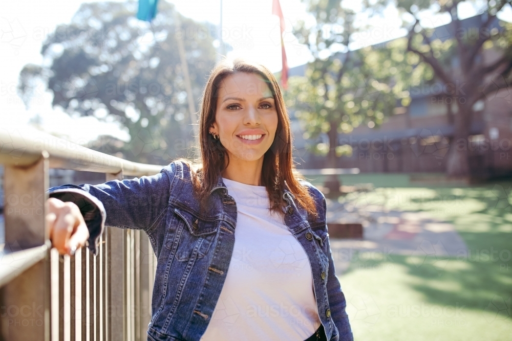 First Nations public school teacher smiling at the camera - Australian Stock Image