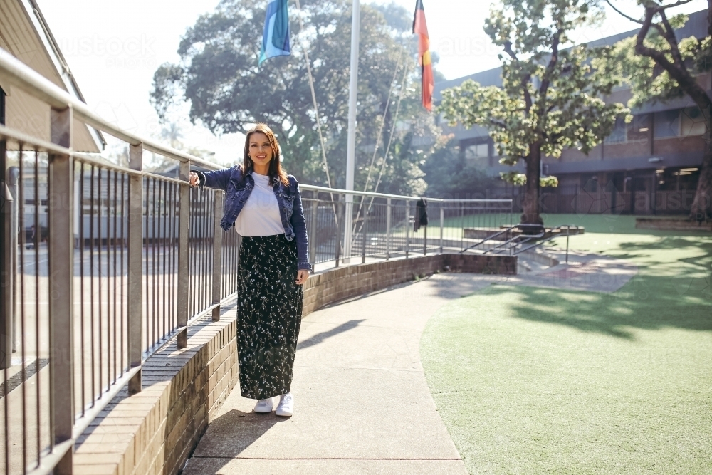 First Nations public school teacher smiling at the camera - Australian Stock Image