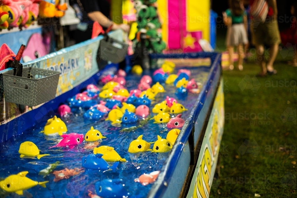 fishing style carnival game with shark toys - Australian Stock Image