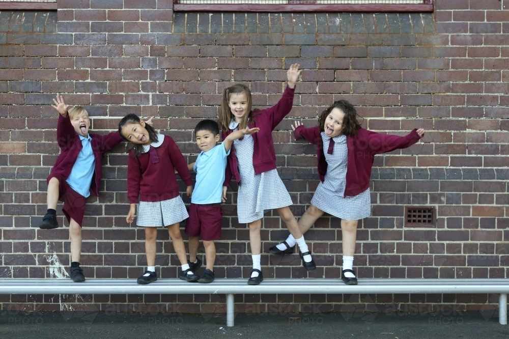 Five happy school kids being silly for the camera - Australian Stock Image