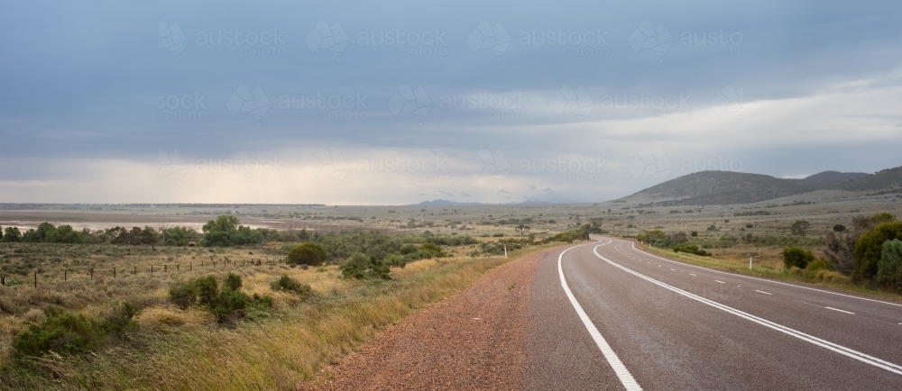 Flinders Ranges road with stormy sky - Australian Stock Image