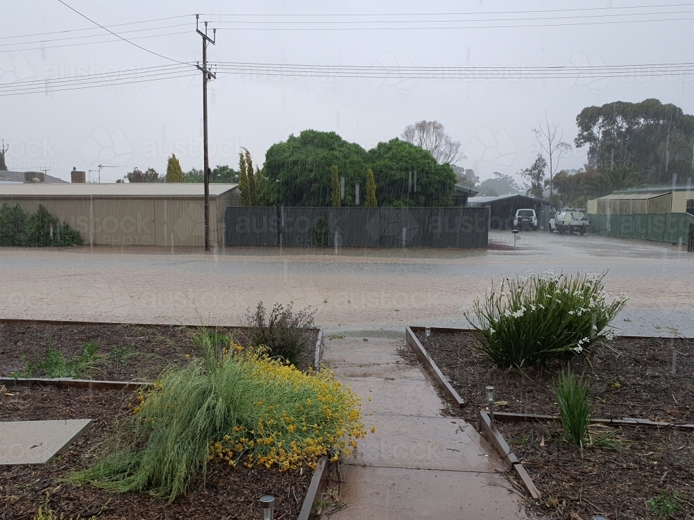 flooded street in heavy rain - natural disaster - Australian Stock Image