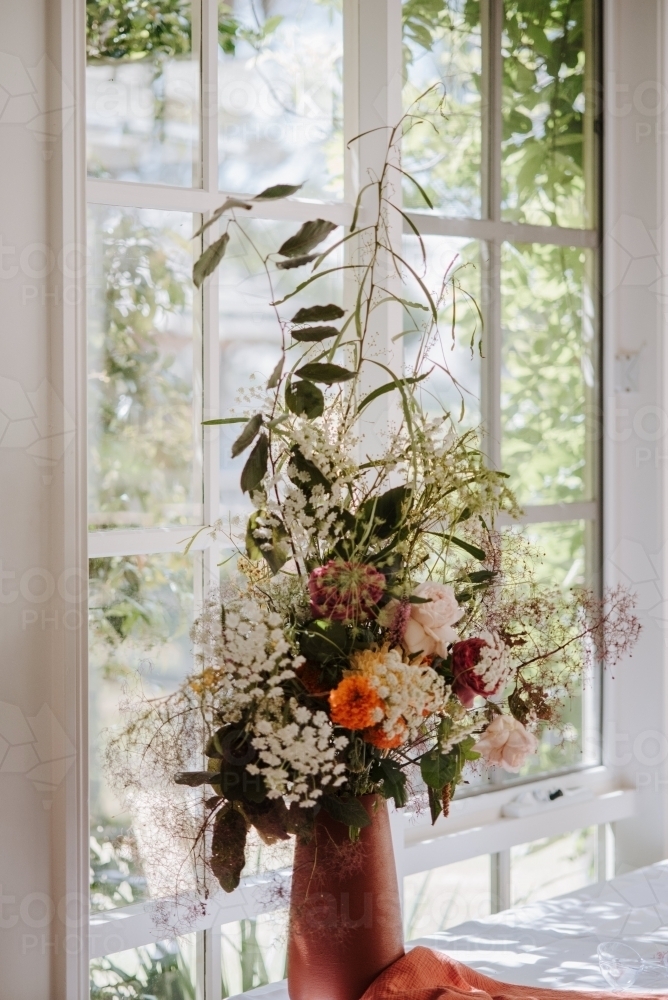 Flower arrangement in window - Australian Stock Image