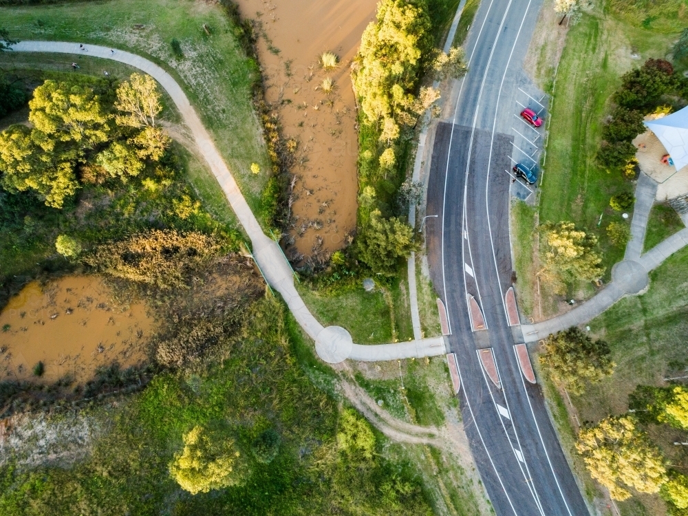 Footpath and cycleway crossing the road to a park - Australian Stock Image