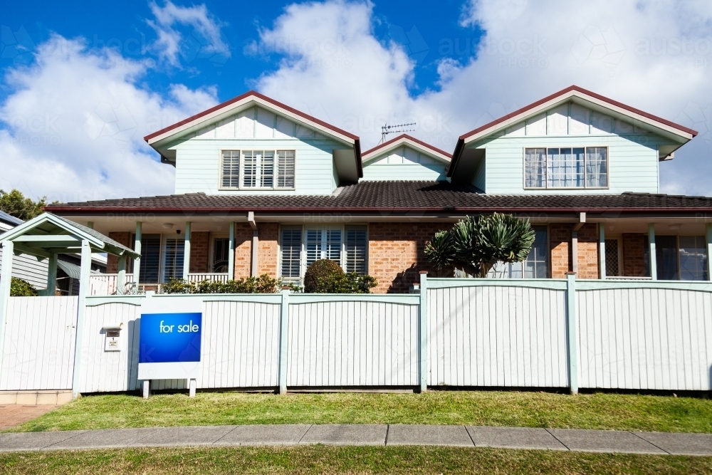 For Sale sign outside home - Australian Stock Image