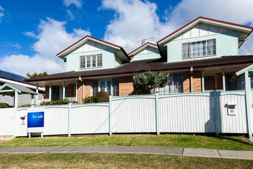 For Sale sign outside home - Australian Stock Image