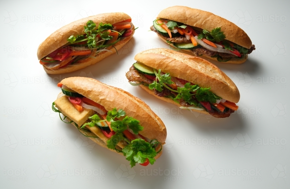 Four banh mi on blank background - Australian Stock Image