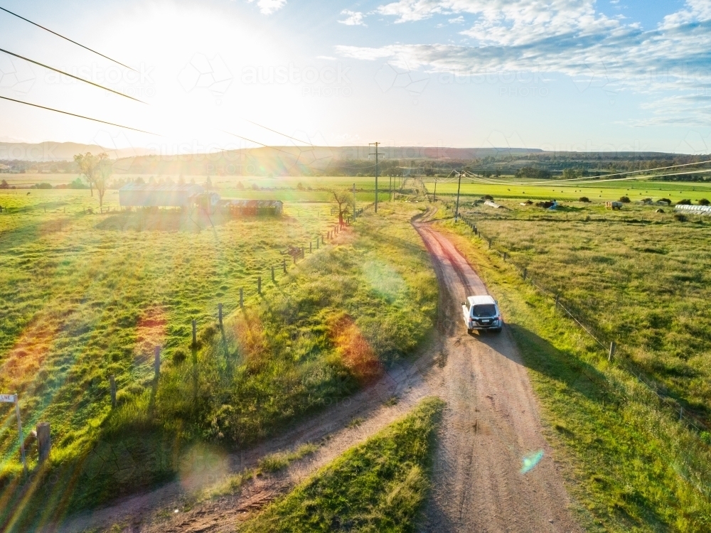 Four wheel drive car on country road trip driving on gravel road - Hope and adventure concept - Australian Stock Image