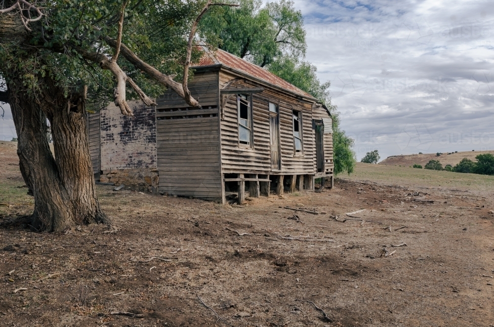 Fragile Old Farmhouse in dry paddock - Australian Stock Image