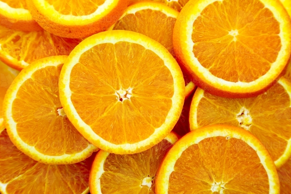 Fresh orange slices filling frame - Australian Stock Image