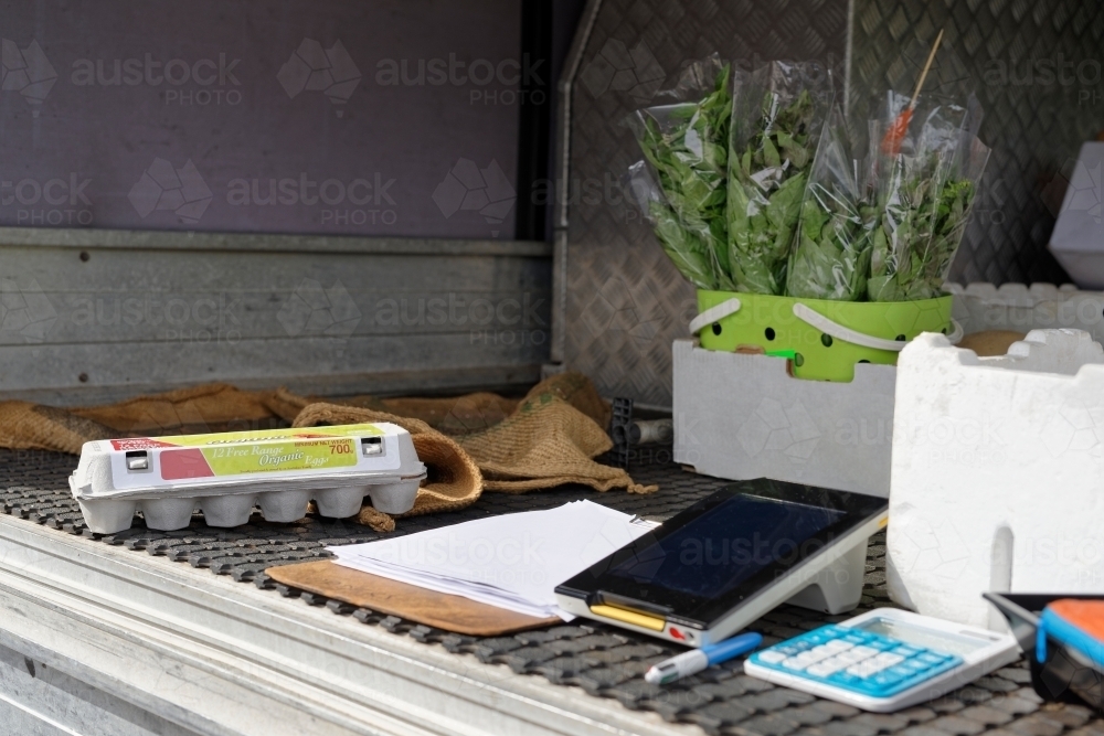 Fresh produce and electronics displayed in the back of the ute or car - Australian Stock Image