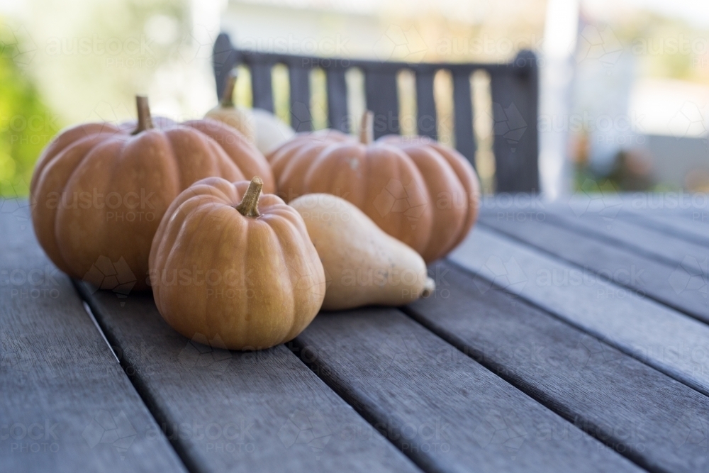 Fresh pumpkins on a wooden table - Australian Stock Image