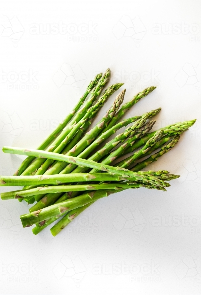 Fresh spring asparagus on the kitchen bench - Australian Stock Image