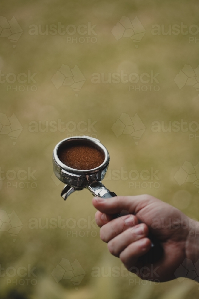 Freshly ground and tamped coffee ready to pull an espresso shot - Australian Stock Image