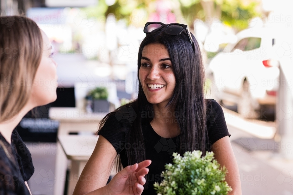 friends chatting in a cafe - Australian Stock Image