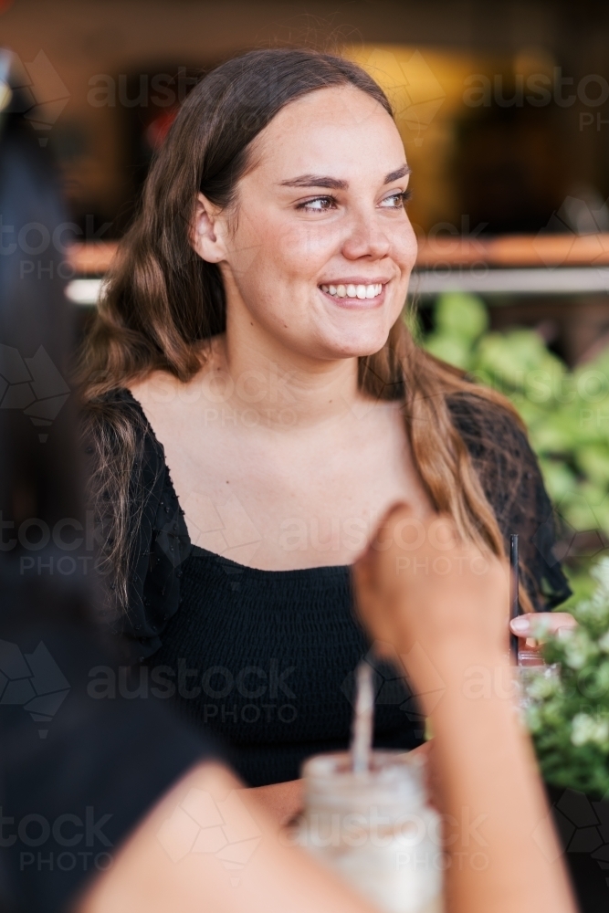 friends chatting in a cafe - Australian Stock Image