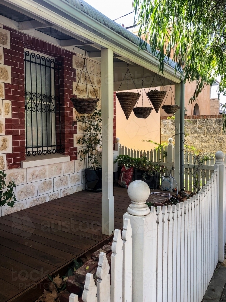 Front porch verandah and white picket fence of colonial home. - Australian Stock Image