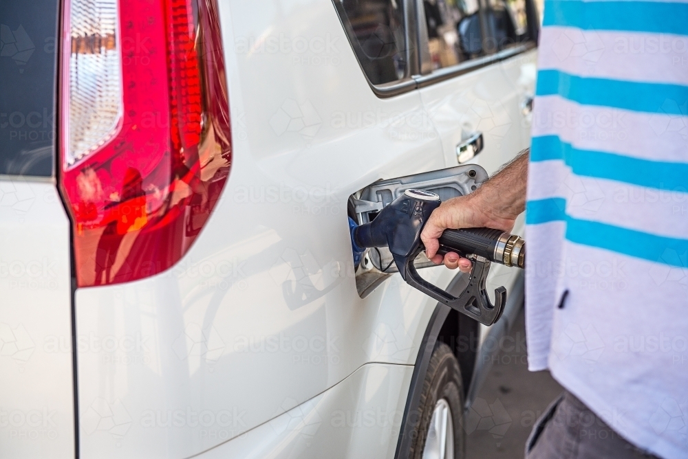 Fuelling up car at petrol station - Australian Stock Image