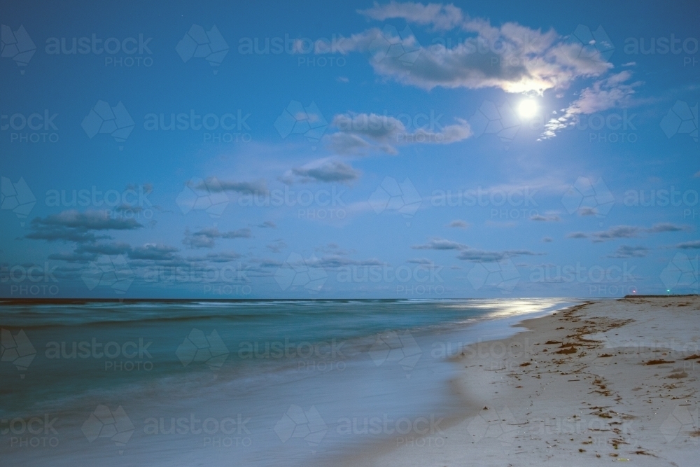 Full moon over the coastline at the beach - Australian Stock Image