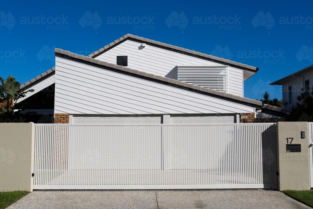 Garage gateway and driveway to a modern coastal home - Australian Stock Image