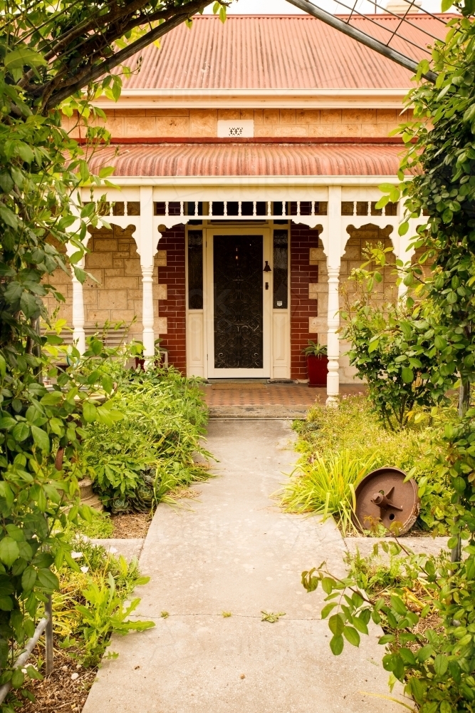 Garden path leading to front door of old house - Australian Stock Image