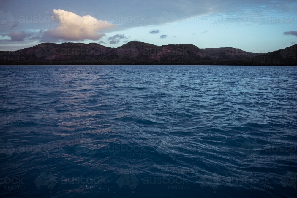 Gentle ripples and waves of the sea with a visible horizon - Australian Stock Image