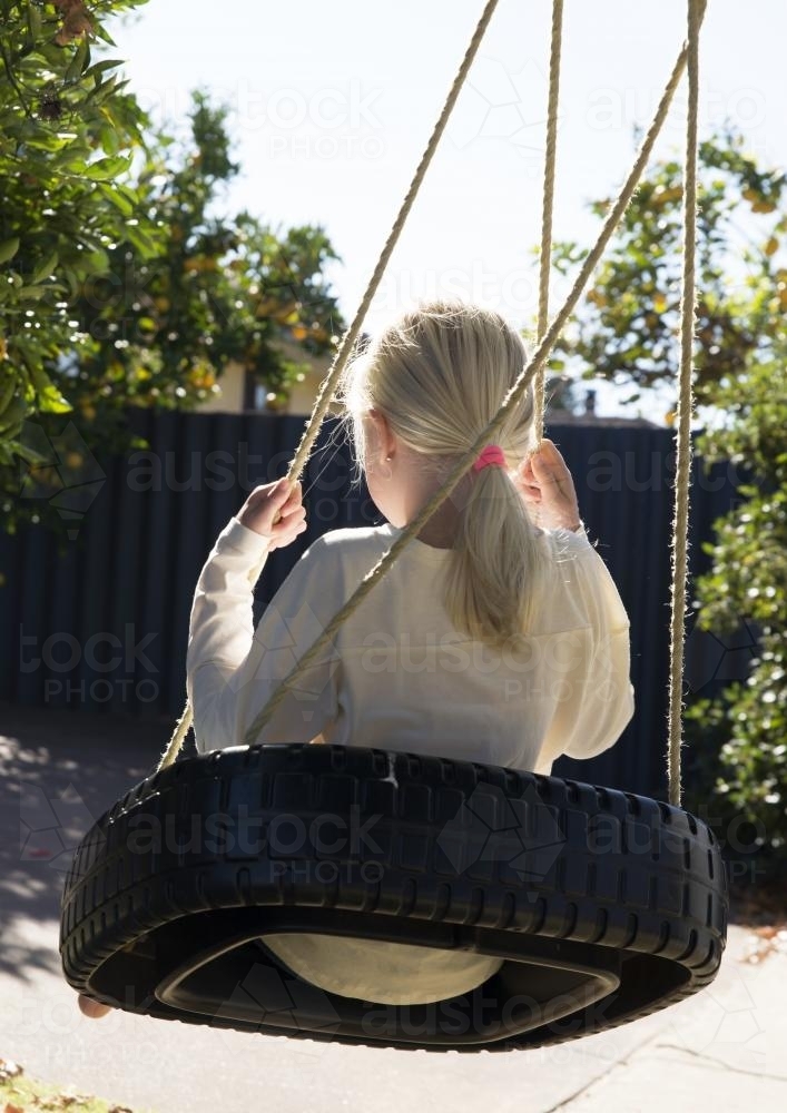 Girl on swing - Australian Stock Image