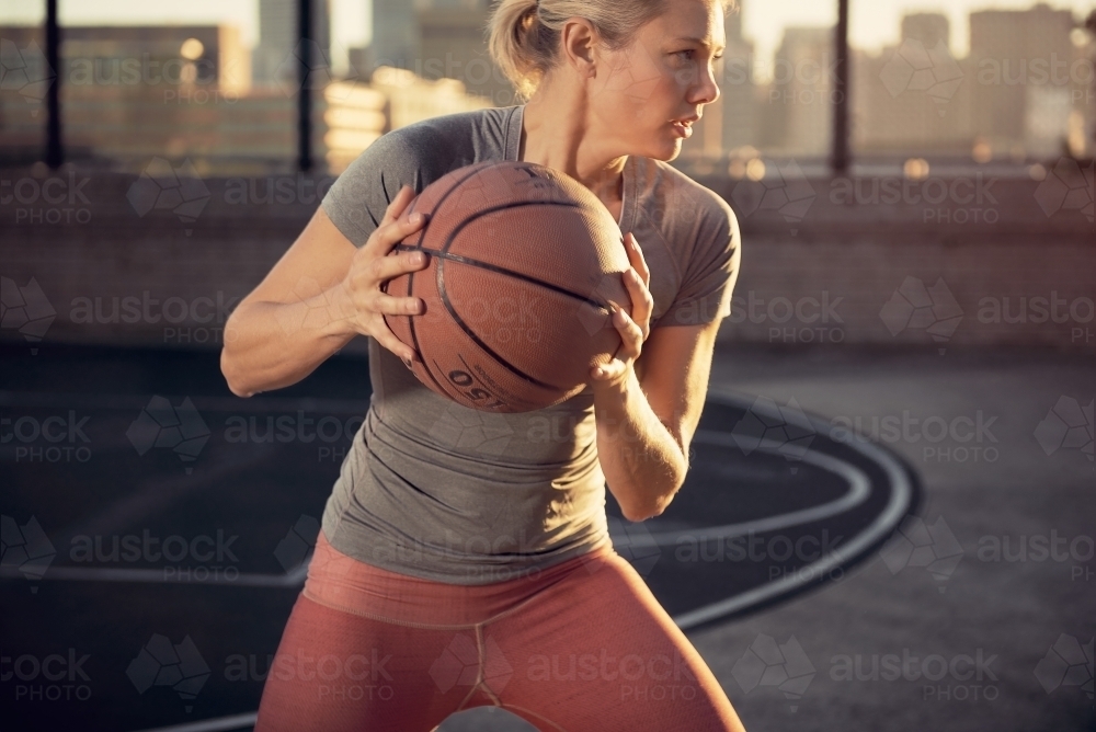 girl passing basketball - Australian Stock Image