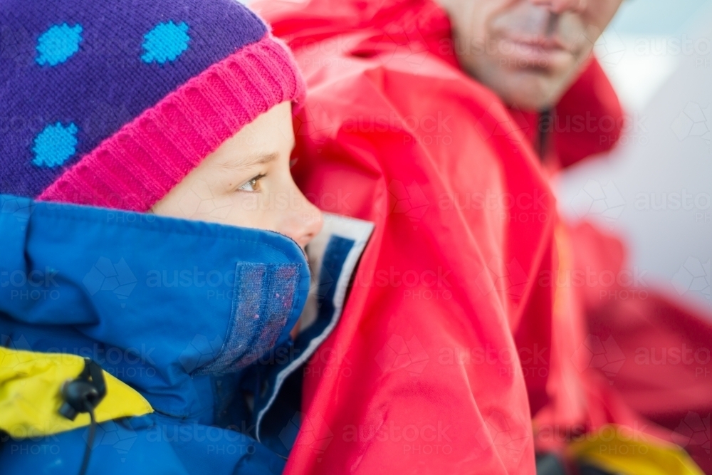 Girl rugged up warm in jacket with beanie - Australian Stock Image