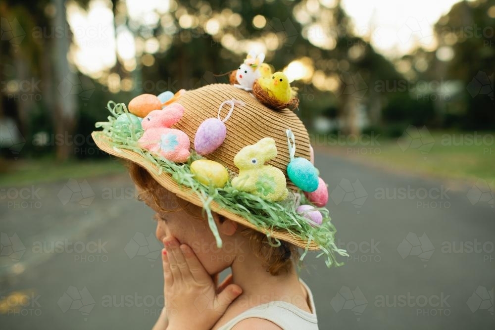 Girl wearing an Easter hat in the street - Australian Stock Image