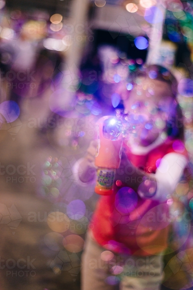 girl with bubble machine, abstract and blurr - Australian Stock Image