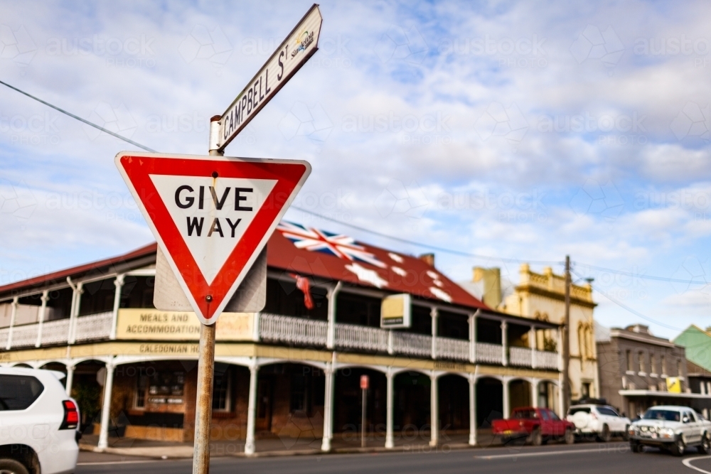 Give way street sign at intersection of side road with main street in Aussie town - Australian Stock Image