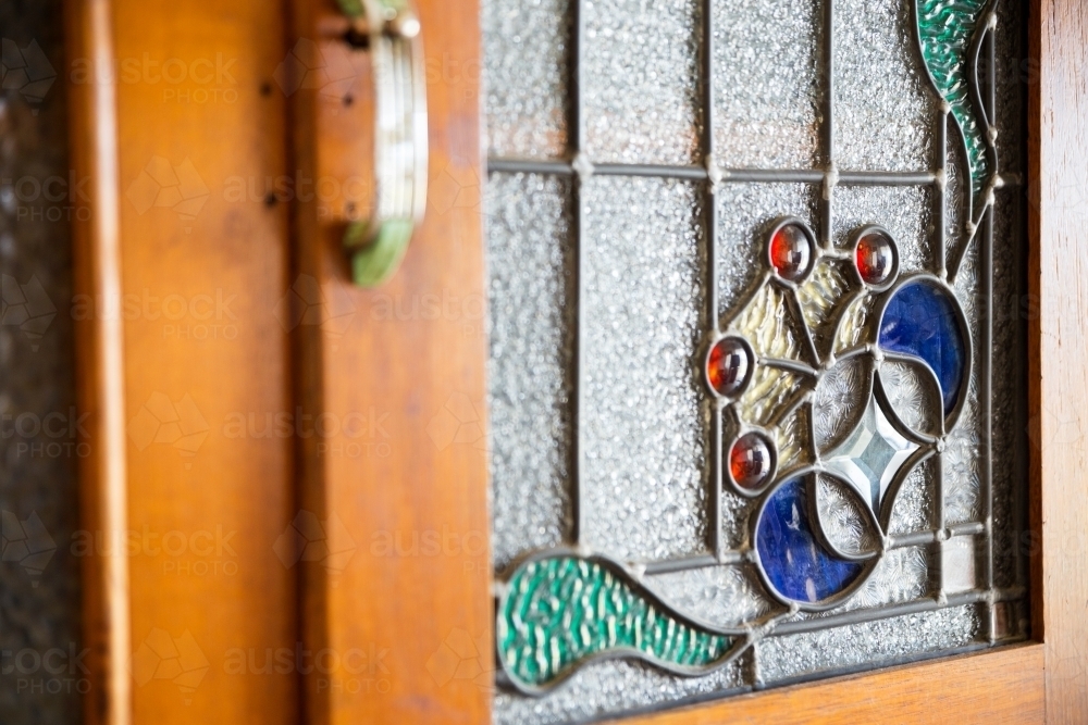 Glass leadlight in cupboard door - Australian Stock Image