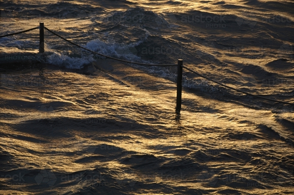 Golden light over ocean - Australian Stock Image