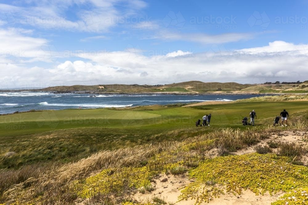 Golfers leave the green on Ocean Dunes Golf Course - Australian Stock Image