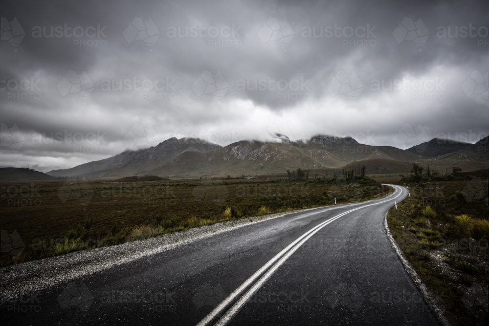 Gordon River Rd at the Sentinel range of mountains on overcast day - Australian Stock Image