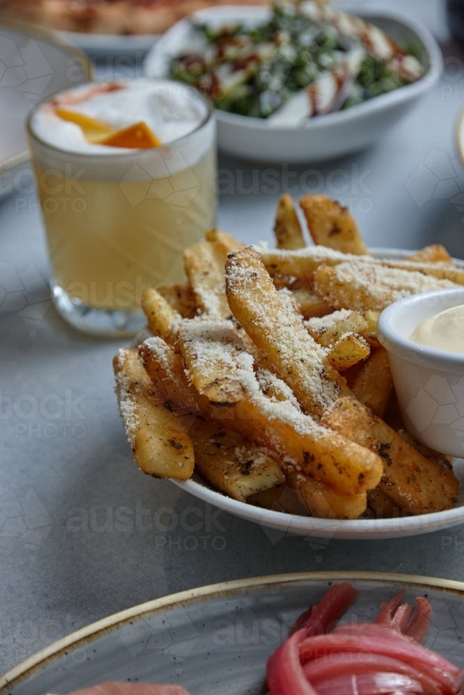 Gourmet hot chips with mayonnaise dip - Australian Stock Image