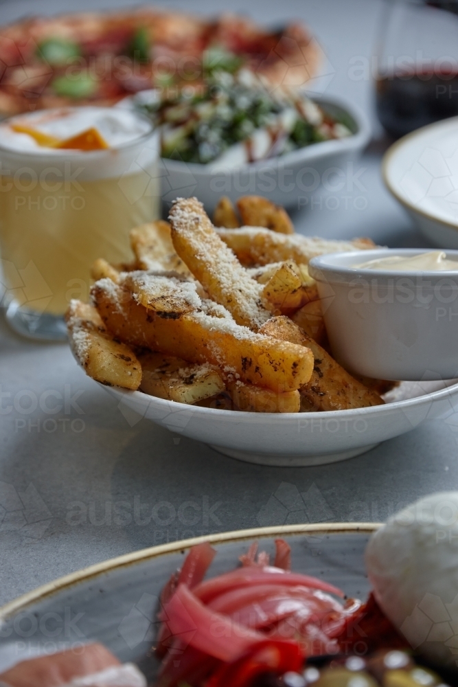 Gourmet hot chips with mayonnaise dip - Australian Stock Image