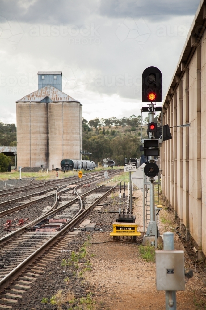 Grain silos with train beside railway - Australian Stock Image