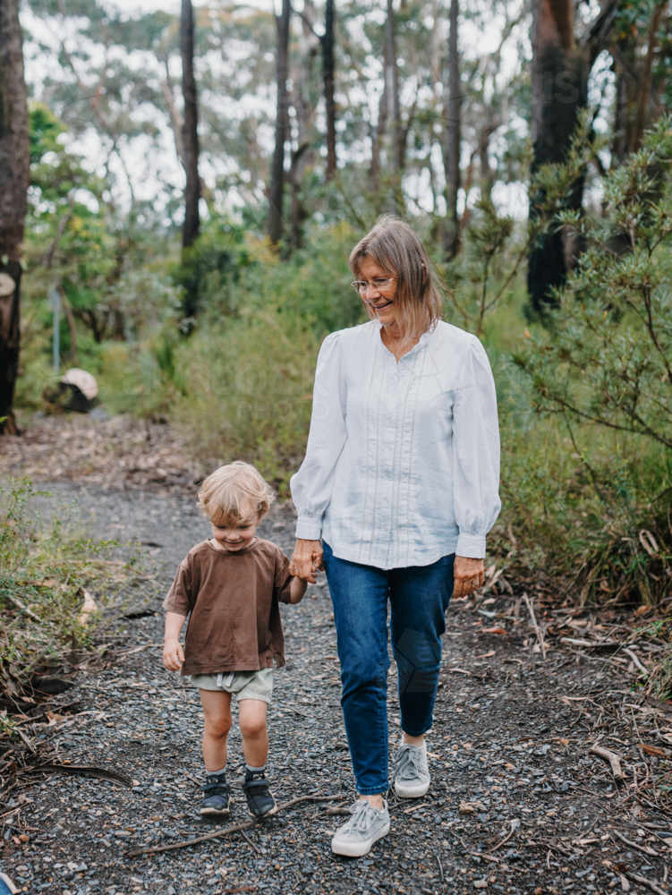 Grandmother spending time with grandson in nature - Australian Stock Image