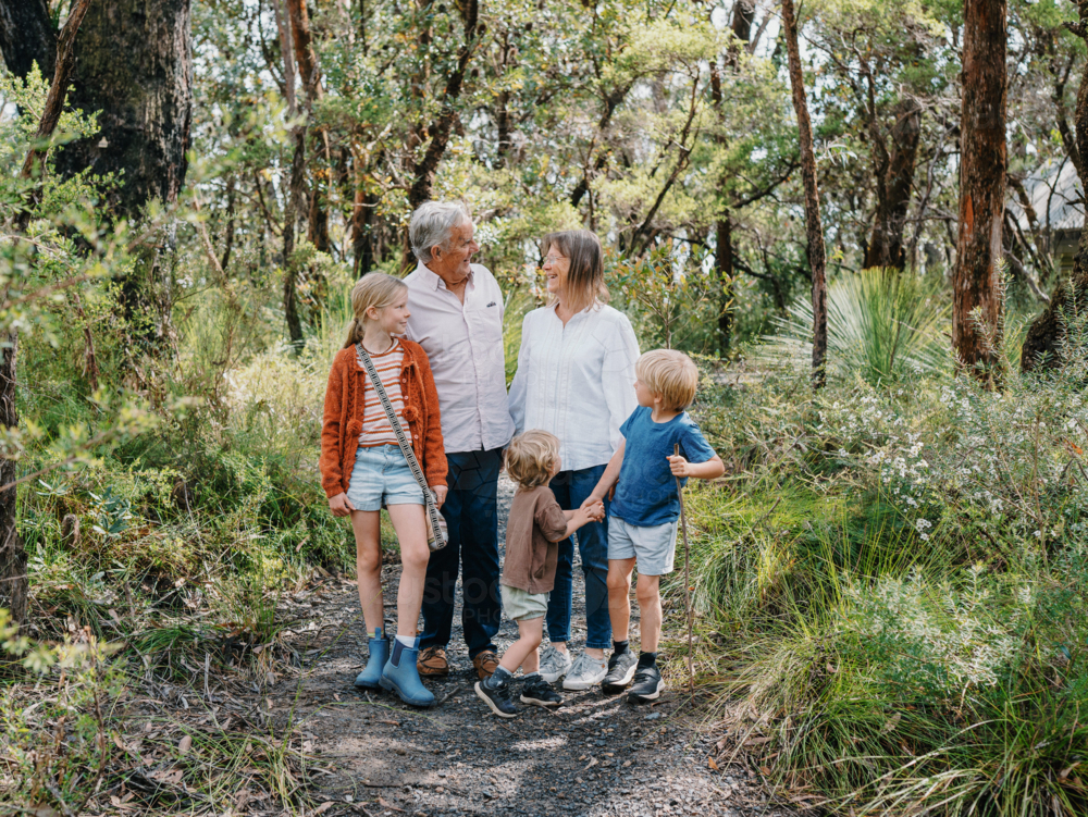 Grandparents enjoying Australian Bushland outdoors with their Grandchildren - Australian Stock Image