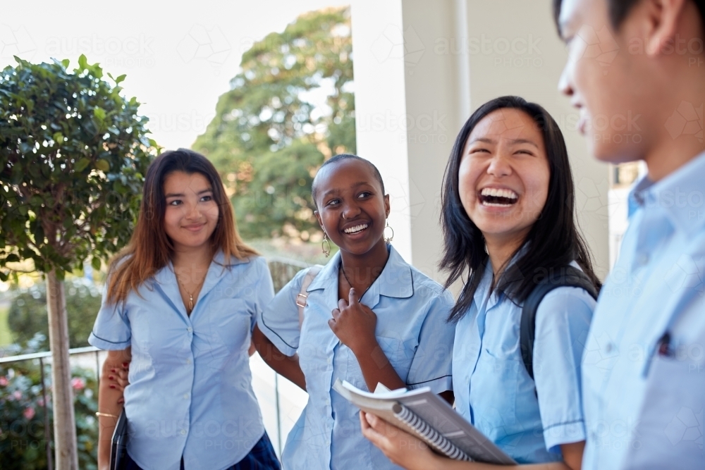 Group of High School students laughing together - Australian Stock Image