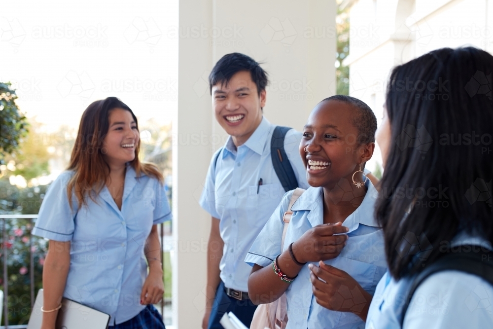 Group of High School students laughing  together - Australian Stock Image