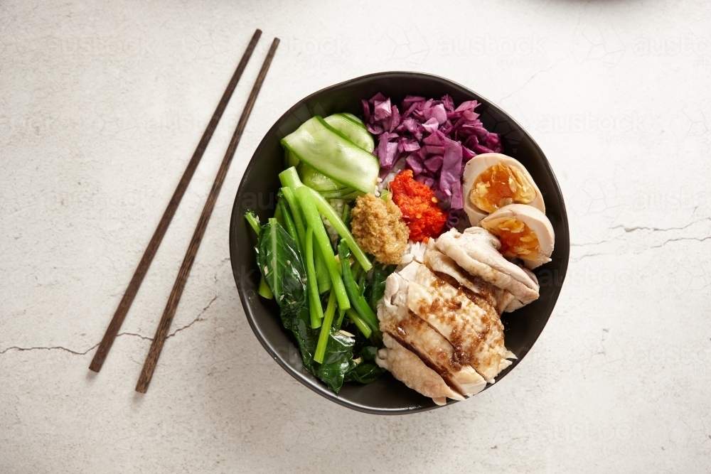 Hainan chicken rice bowl - Australian Stock Image