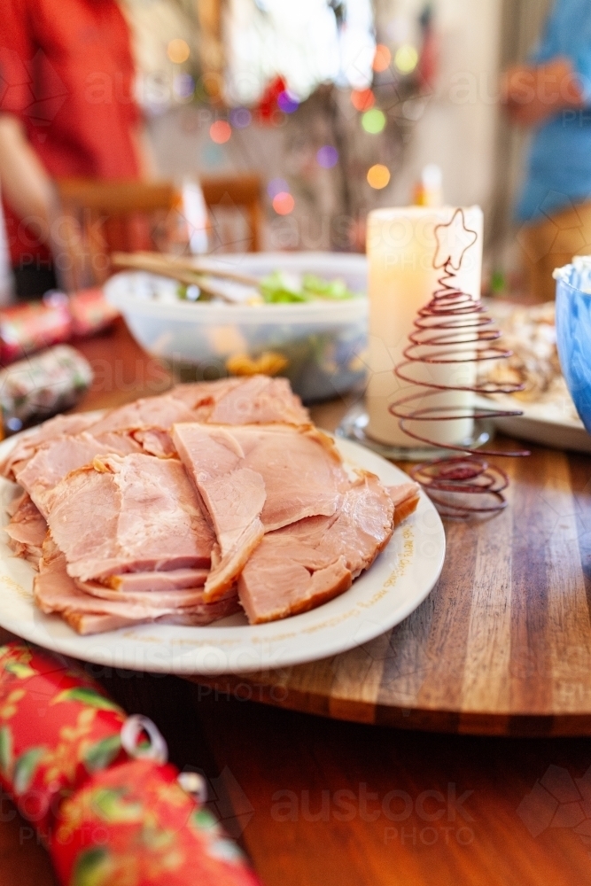 Ham on platter at Christmas lunch table - Australian Stock Image