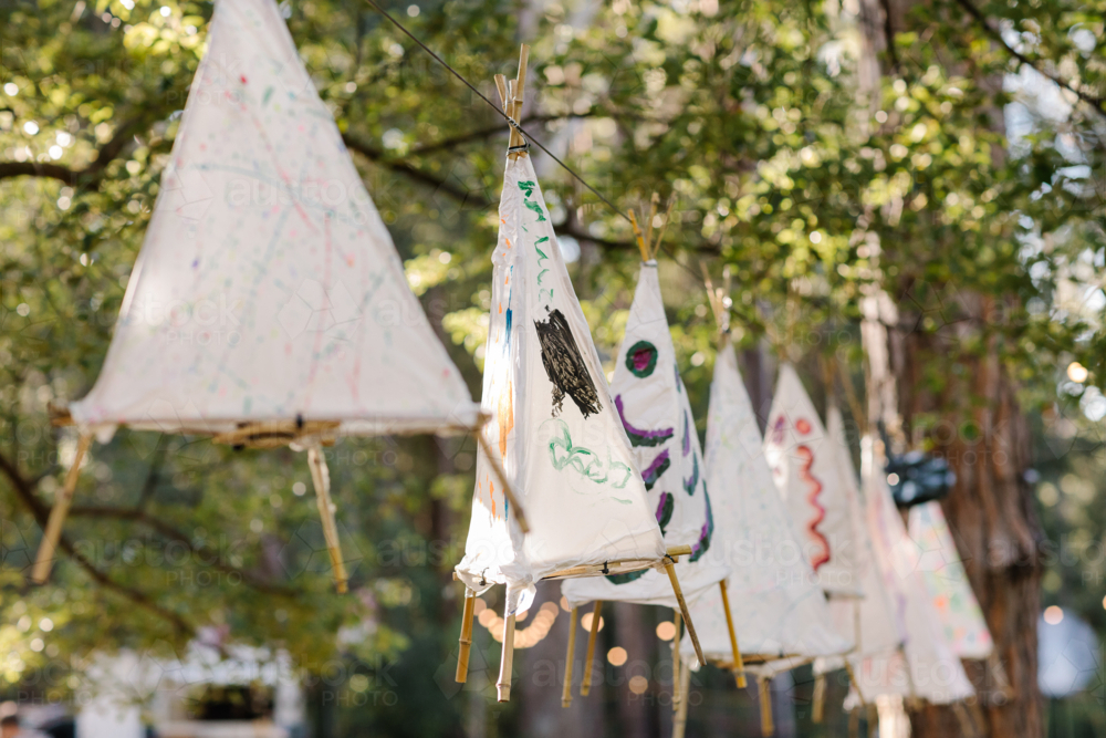 Hand painted tent lanterns hanging on a line. - Australian Stock Image