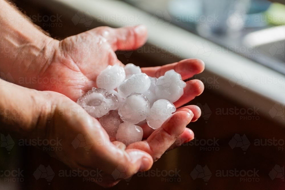 Handful of large hailstones - Australian Stock Image